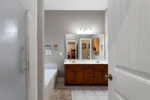 a bathroom with a double vanity sink and mirror