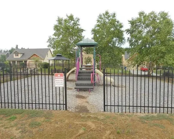 a view of a wrought iron fences in front of house