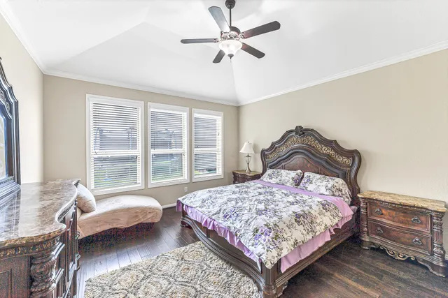 a bedroom with a bed and a couch