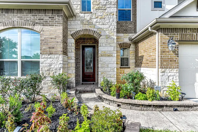 front view of a house with potted plants