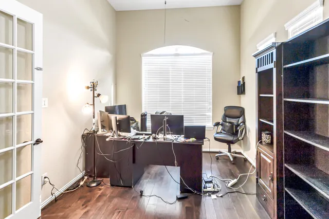 a workspace with furniture and wooden floor