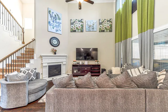 a living room with furniture and a fireplace