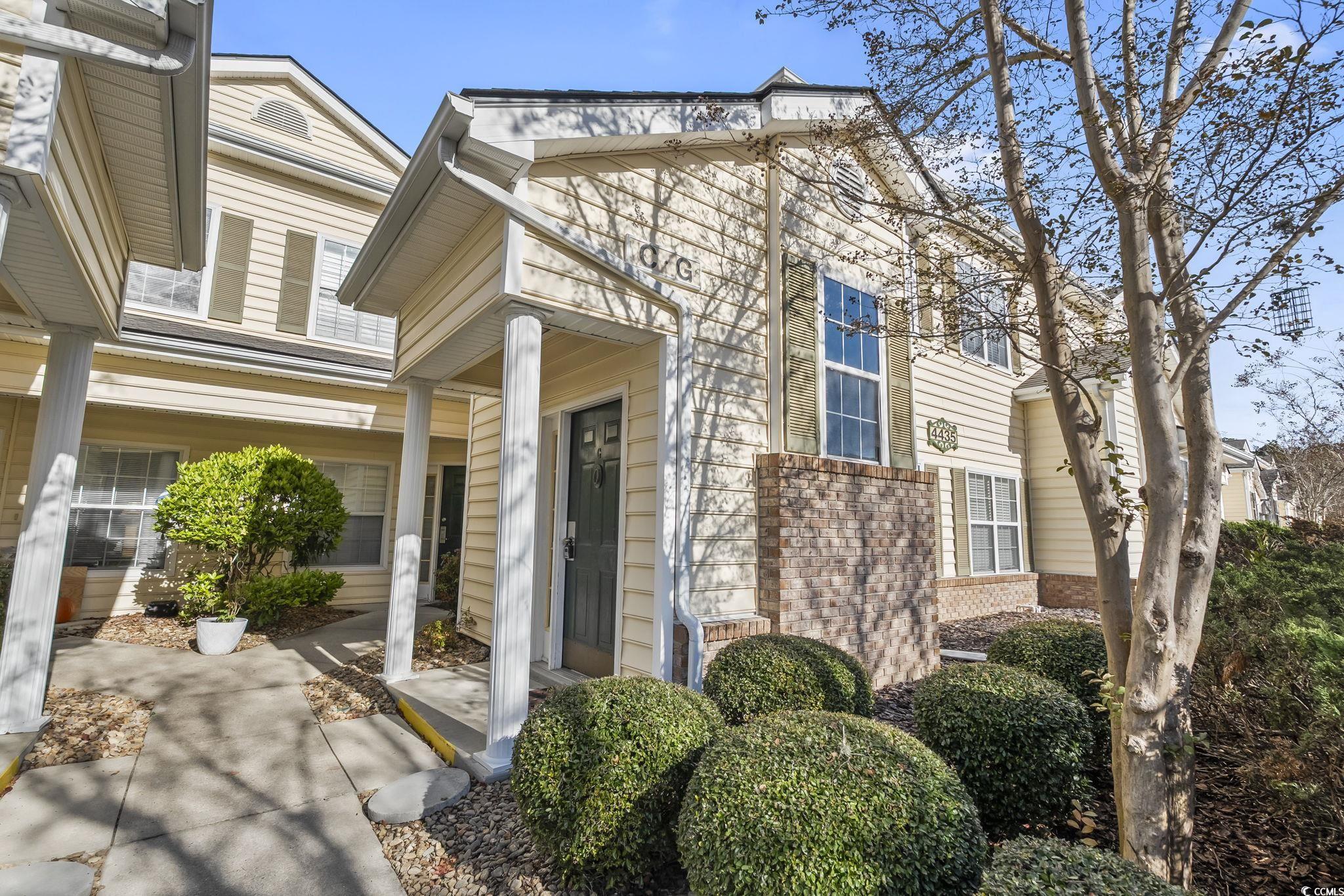 Property entrance with brick siding