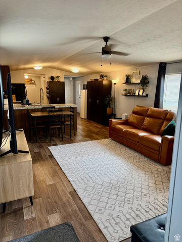 275 North Main Street, Unit 31 Centerfield, UT 84622 - Photo 4 of 13 Living room with dark wood-style flooring, ceiling fan, and a textured ceiling
