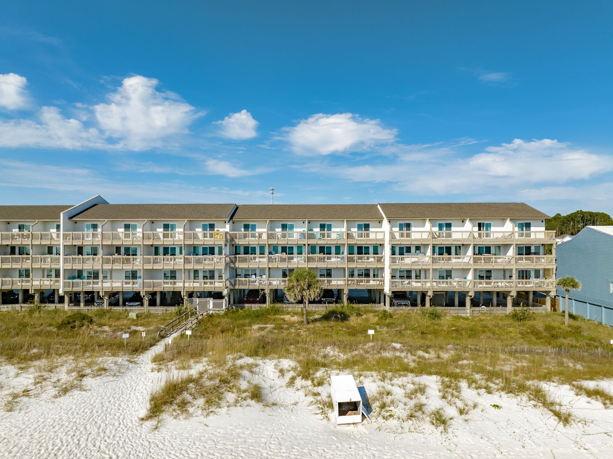 23011 Front Beach Road, Unit F7 Panama City Beach, FL 32413 - Photo 1 of 31 a view of a swimming pool with an outdoor seating