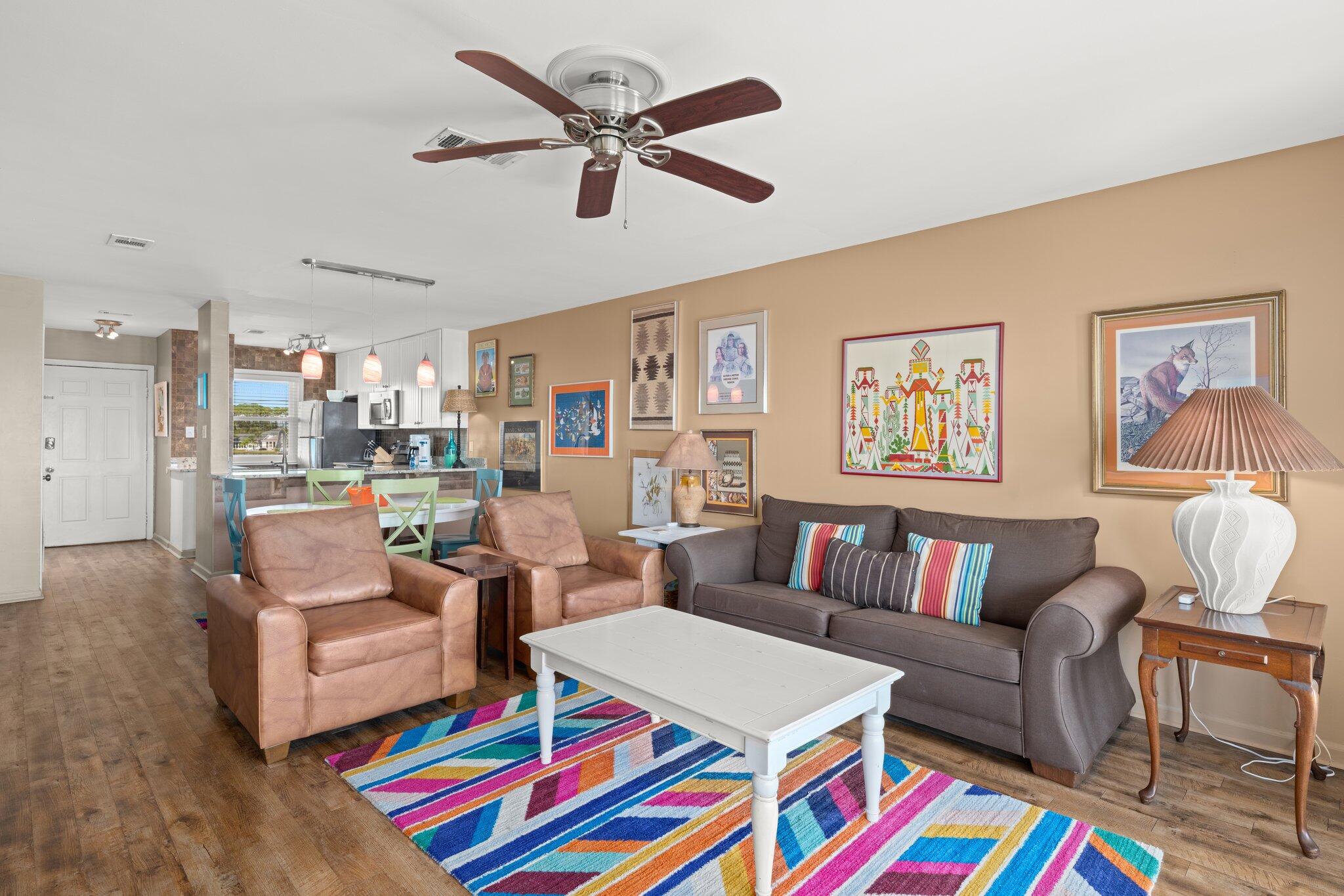 23011 Front Beach Road, Unit F7 Panama City Beach, FL 32413 - Photo 17 of 31 a living room with furniture and a table