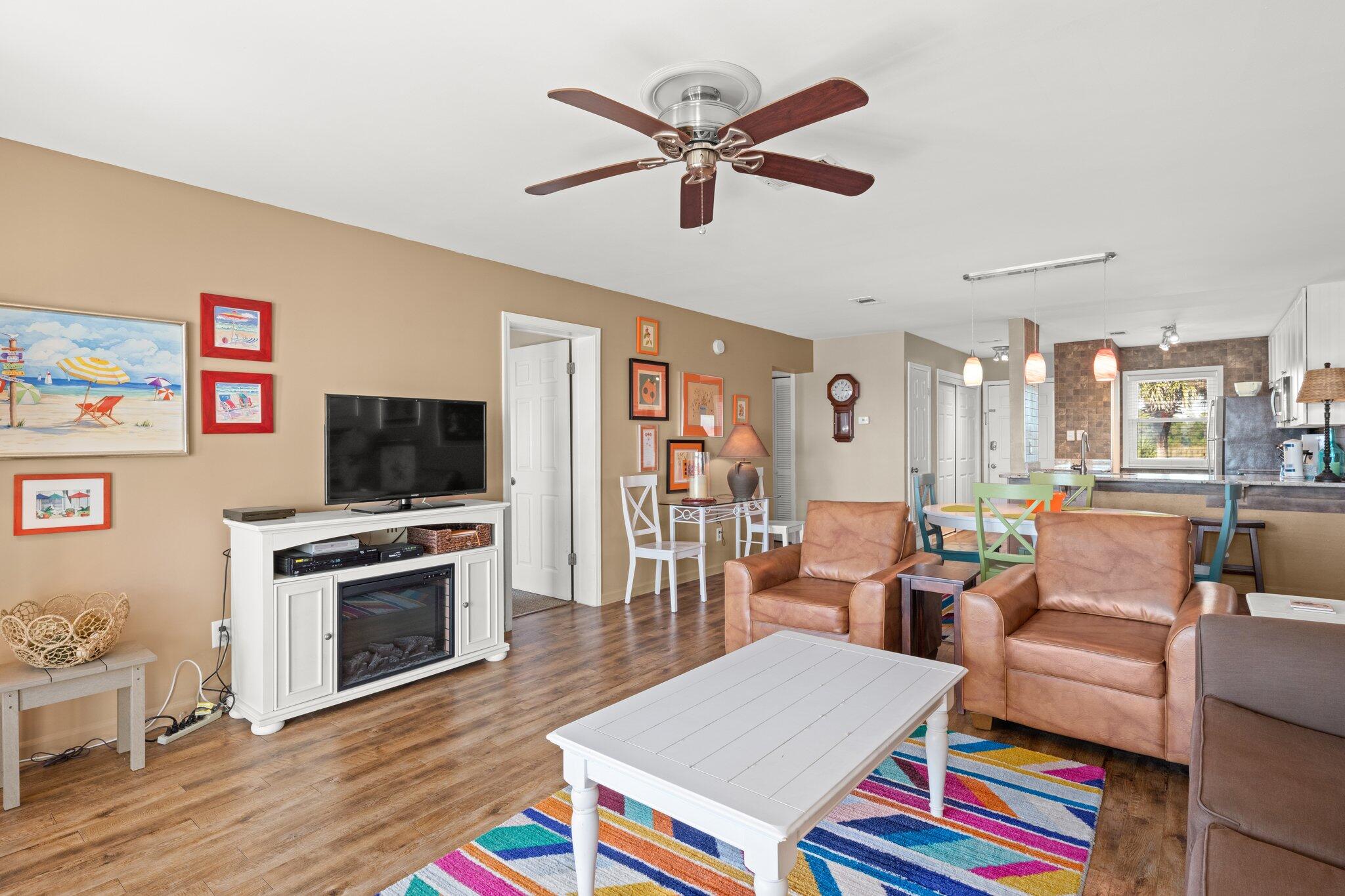 23011 Front Beach Road, Unit F7 Panama City Beach, FL 32413 - Photo 18 of 31 a living room with furniture and a flat screen tv
