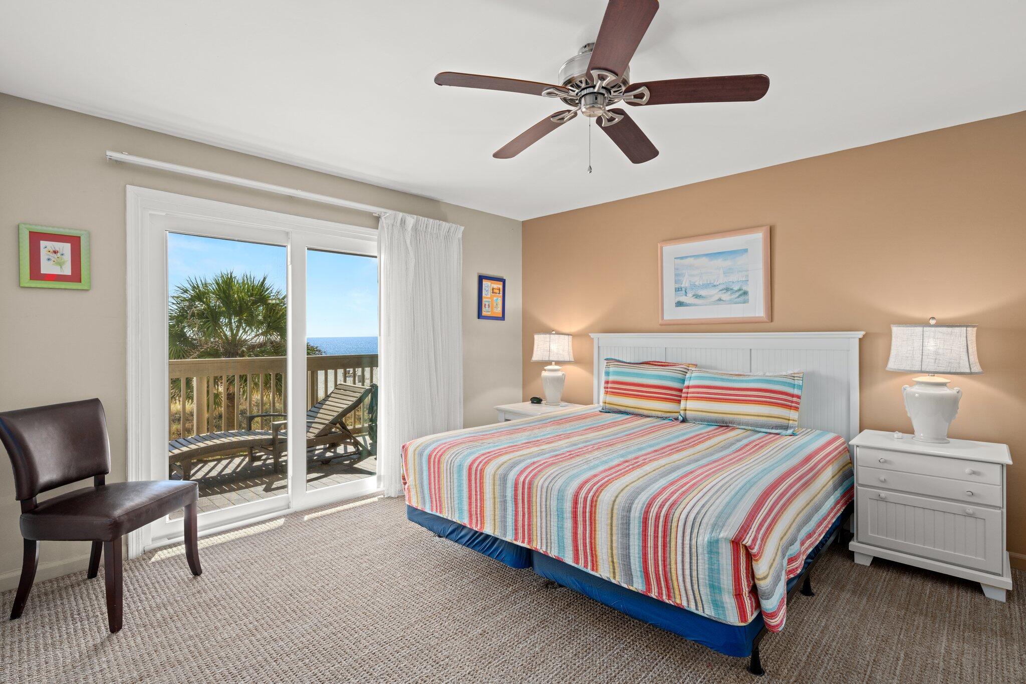 23011 Front Beach Road, Unit F7 Panama City Beach, FL 32413 - Photo 19 of 31 a bedroom with a bed a couch and a window