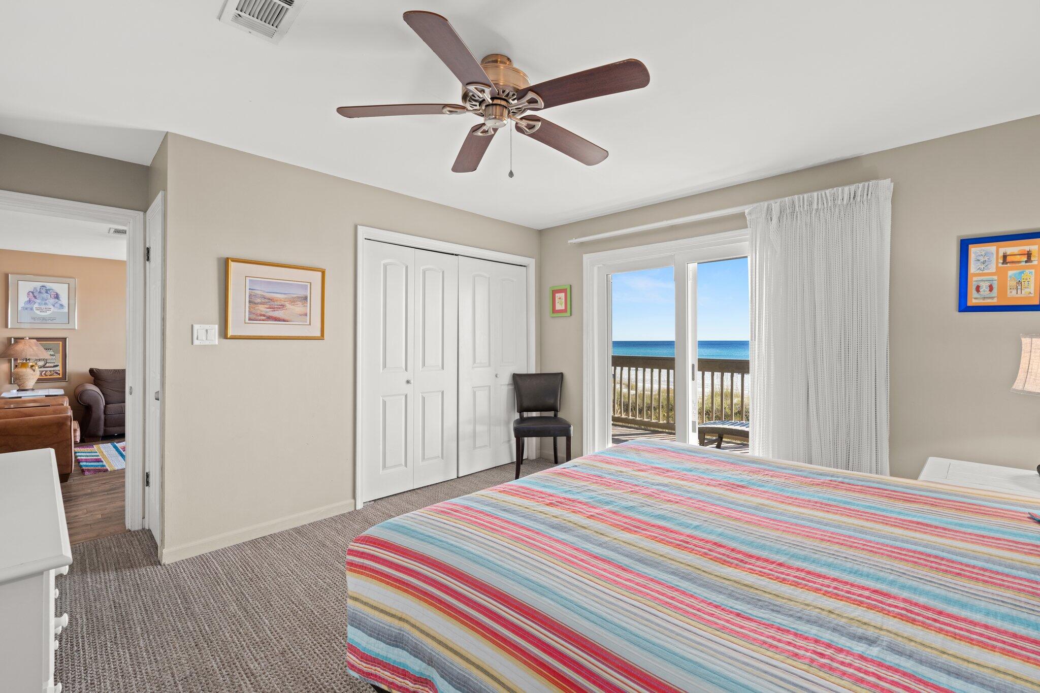 23011 Front Beach Road, Unit F7 Panama City Beach, FL 32413 - Photo 21 of 31 a bedroom with a bed and a large window