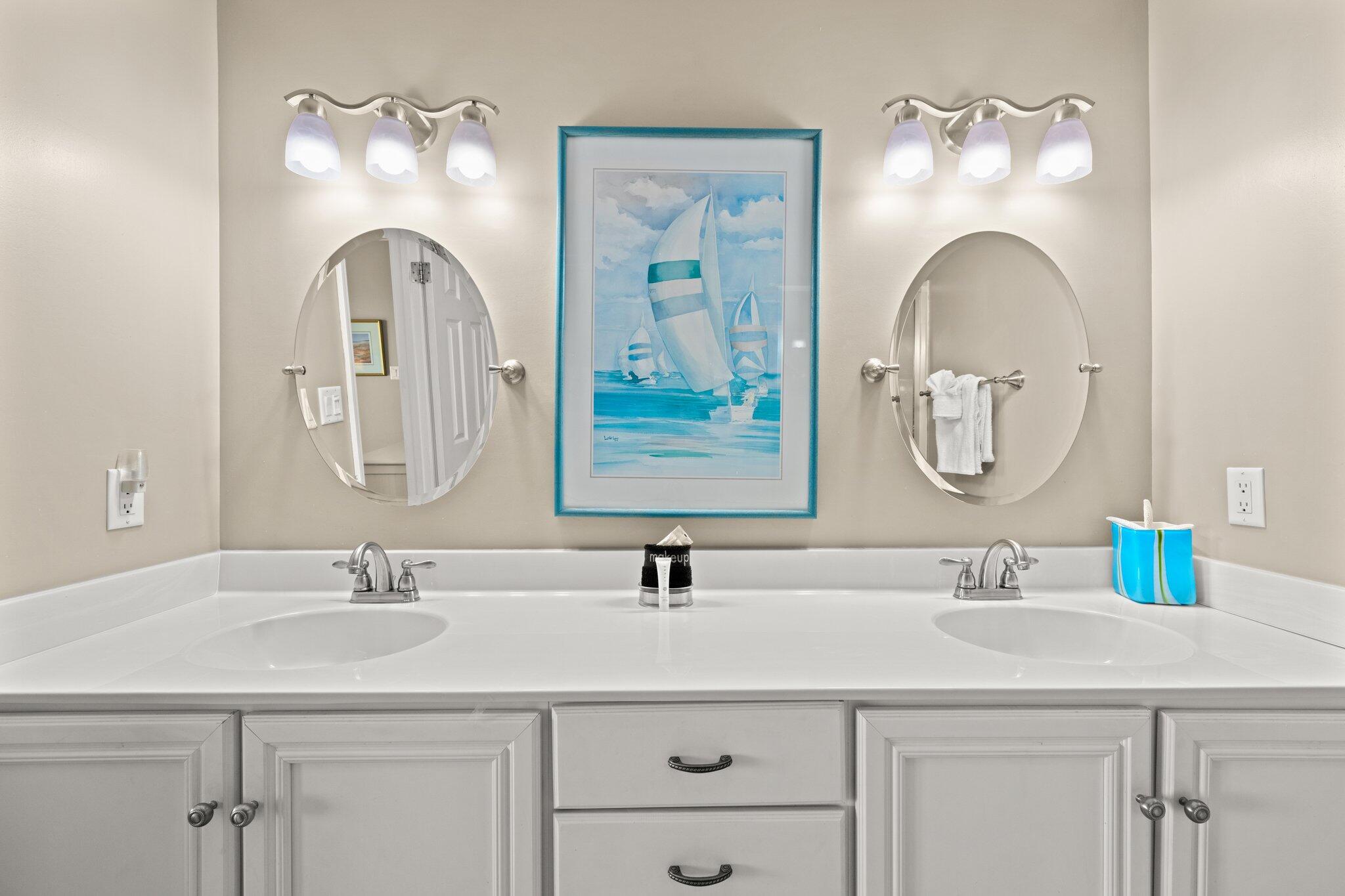 23011 Front Beach Road, Unit F7 Panama City Beach, FL 32413 - Photo 23 of 31 a bathroom with a sink and a mirror