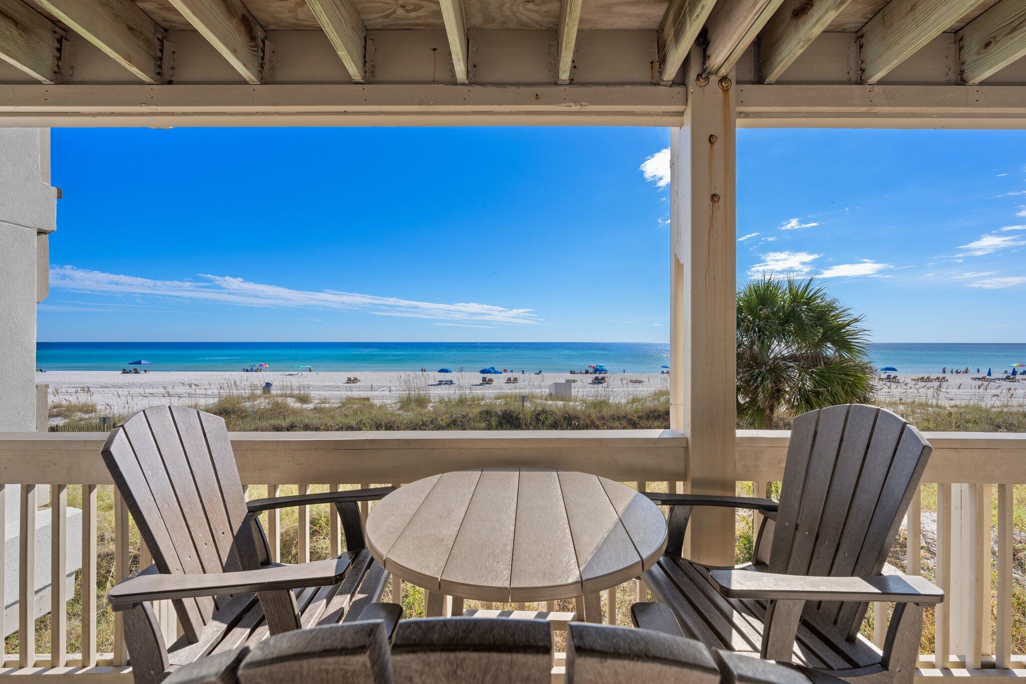 23011 Front Beach Road, Unit F7 Panama City Beach, FL 32413 - Photo 7 of 31 a view of a balcony with chairs