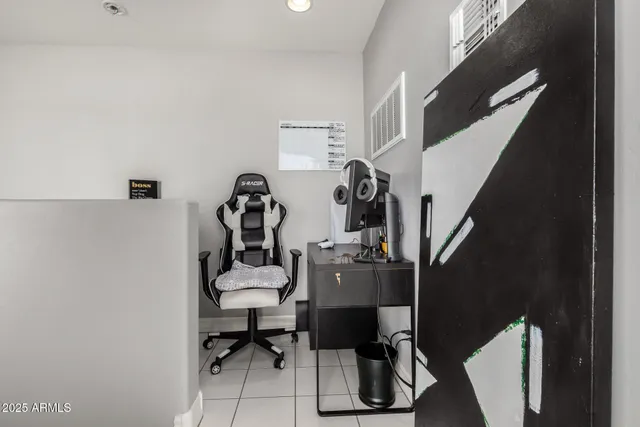 a view of a workspace with furniture