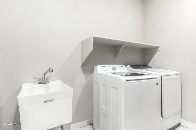a utility room with dryer and washer