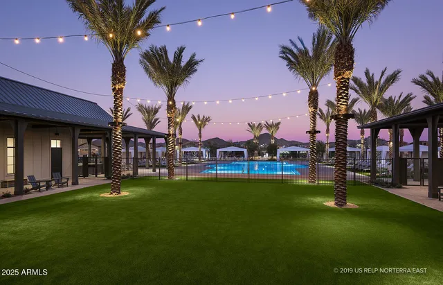 a view of a swimming pool with a table and chairs