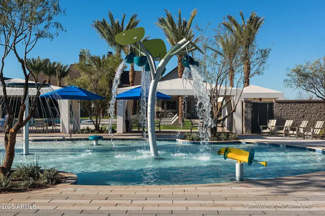 a view of a house with swimming pool and a yard