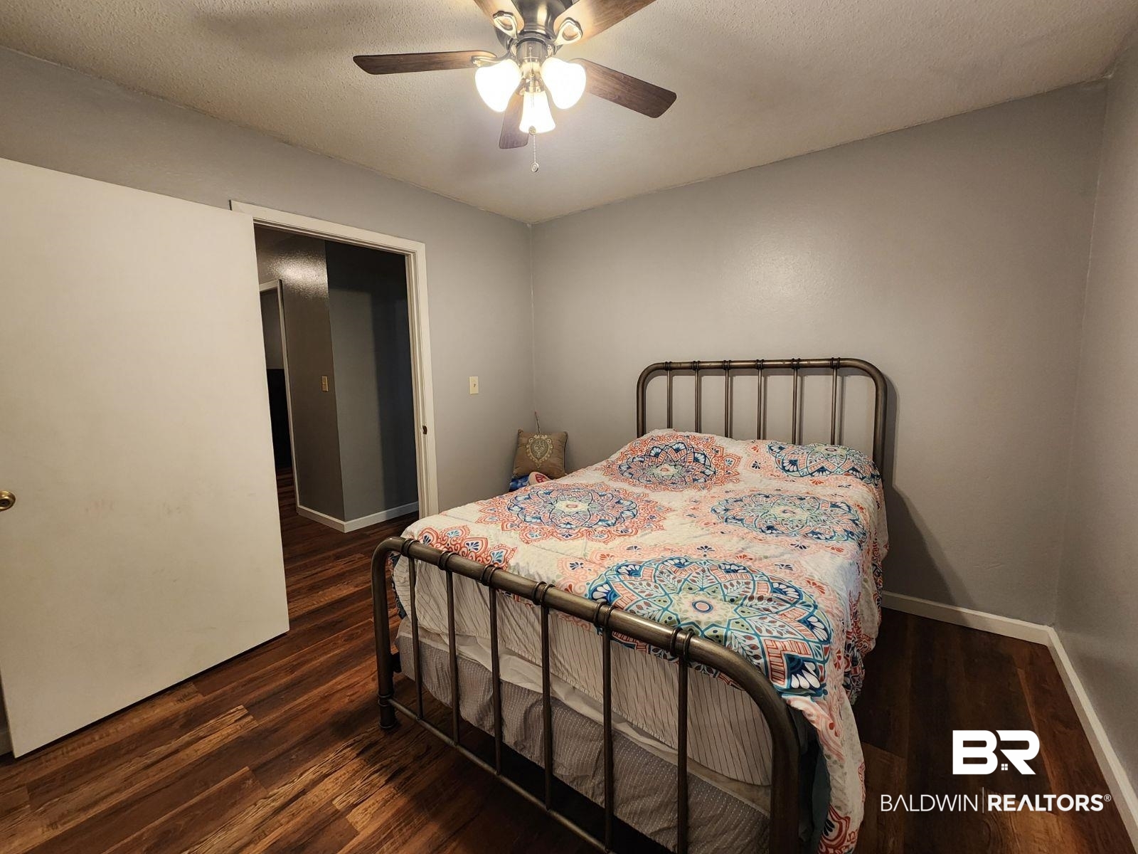 640 Horseshoe Road Brewton, AL 36426 - Photo 13 of 22 Bedroom with dark hardwood / wood-style floors, a textured ceiling, and ceiling fan