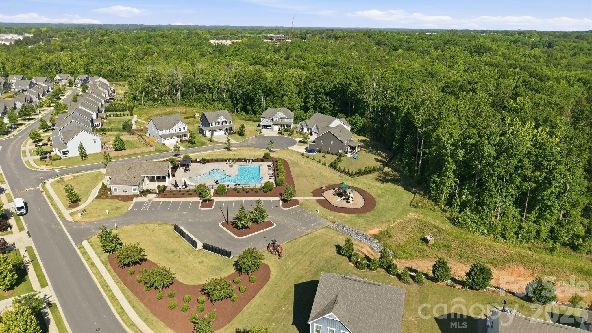 6038 Holland Street Fort Mill, SC 29707 - Photo 47 of 48 a view of a house with pool and chairs