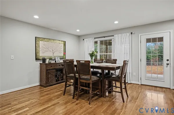 a kitchen with stainless steel appliances granite countertop a refrigerator a stove top oven a sink and dishwasher