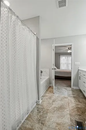 a bedroom with furniture and a window