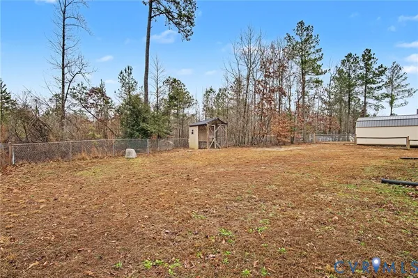 a view of outdoor space with deck and trees