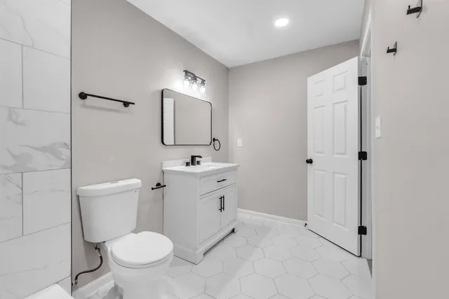 a bathroom with a sink a toilet and a bathtub