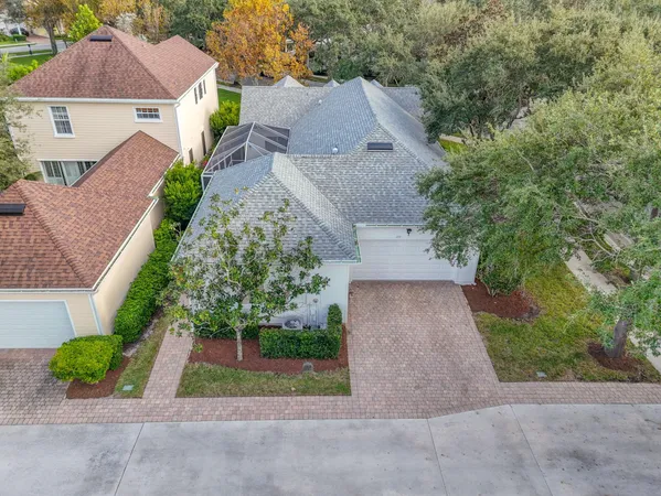 an aerial view of a house with a yard and garden