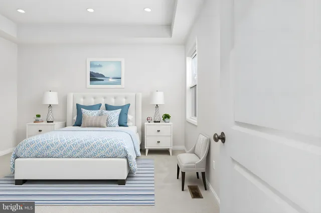 a bedroom with a bed and a chair