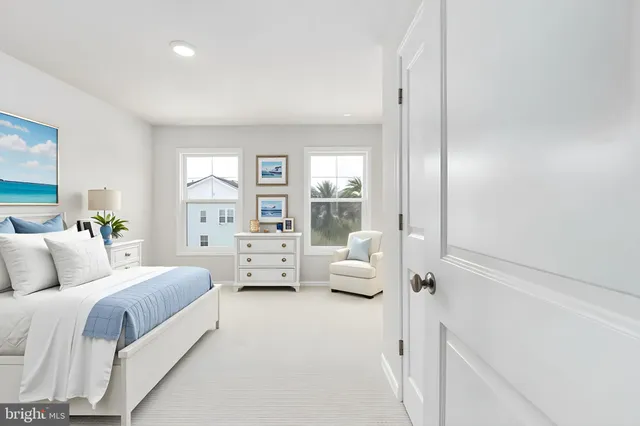 a spacious bedroom with a bed and couch