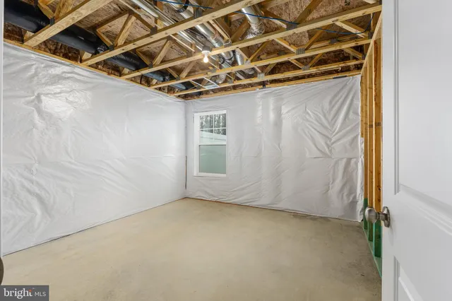 a bathroom with a granite countertop bathtub shower sink vanity and toilet