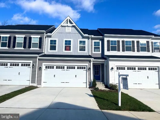 a view of a white house with a large windows