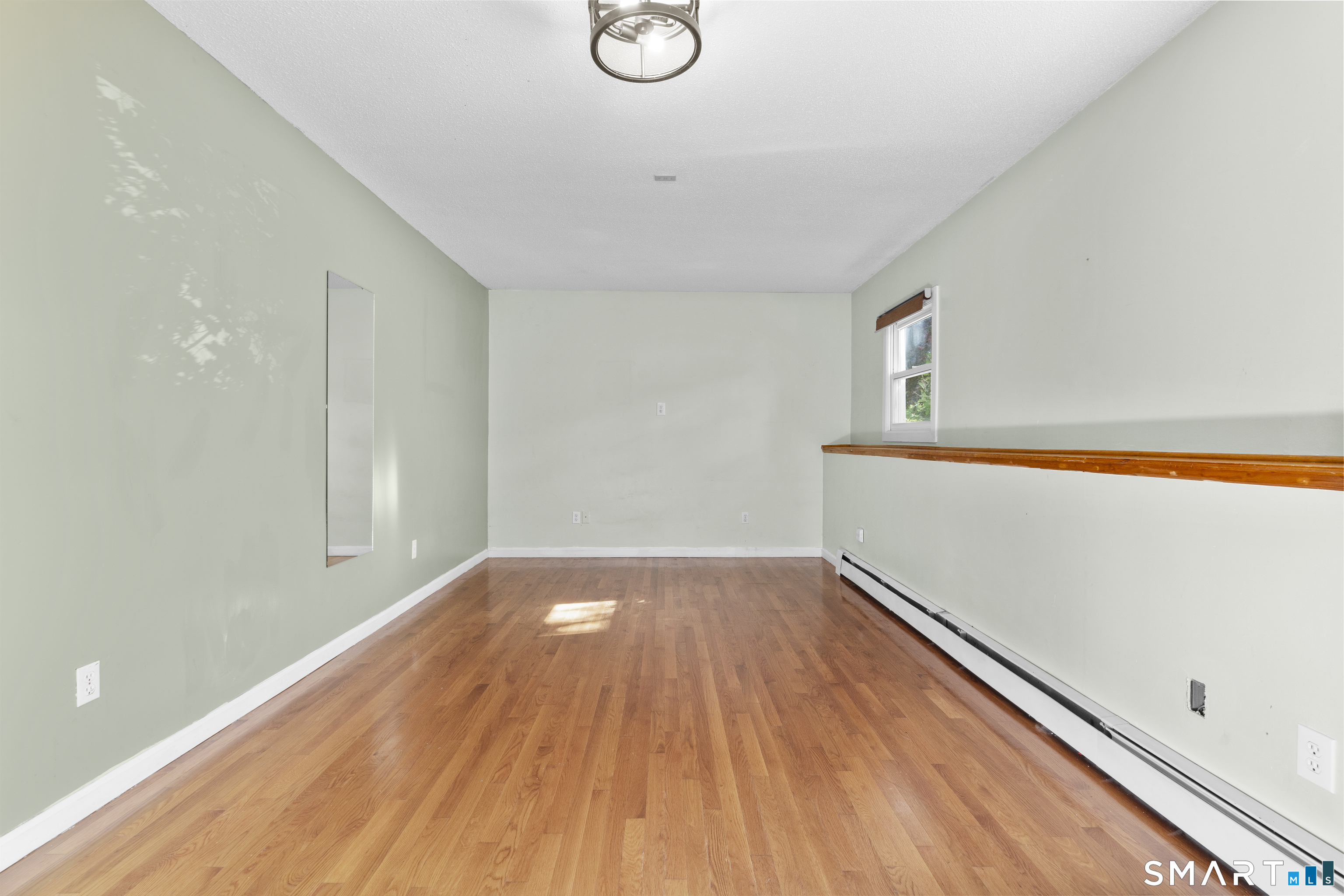 39 Joseph Lane Hamden, CT 06514 - Photo 34 of 40 a view of a room with wooden floor