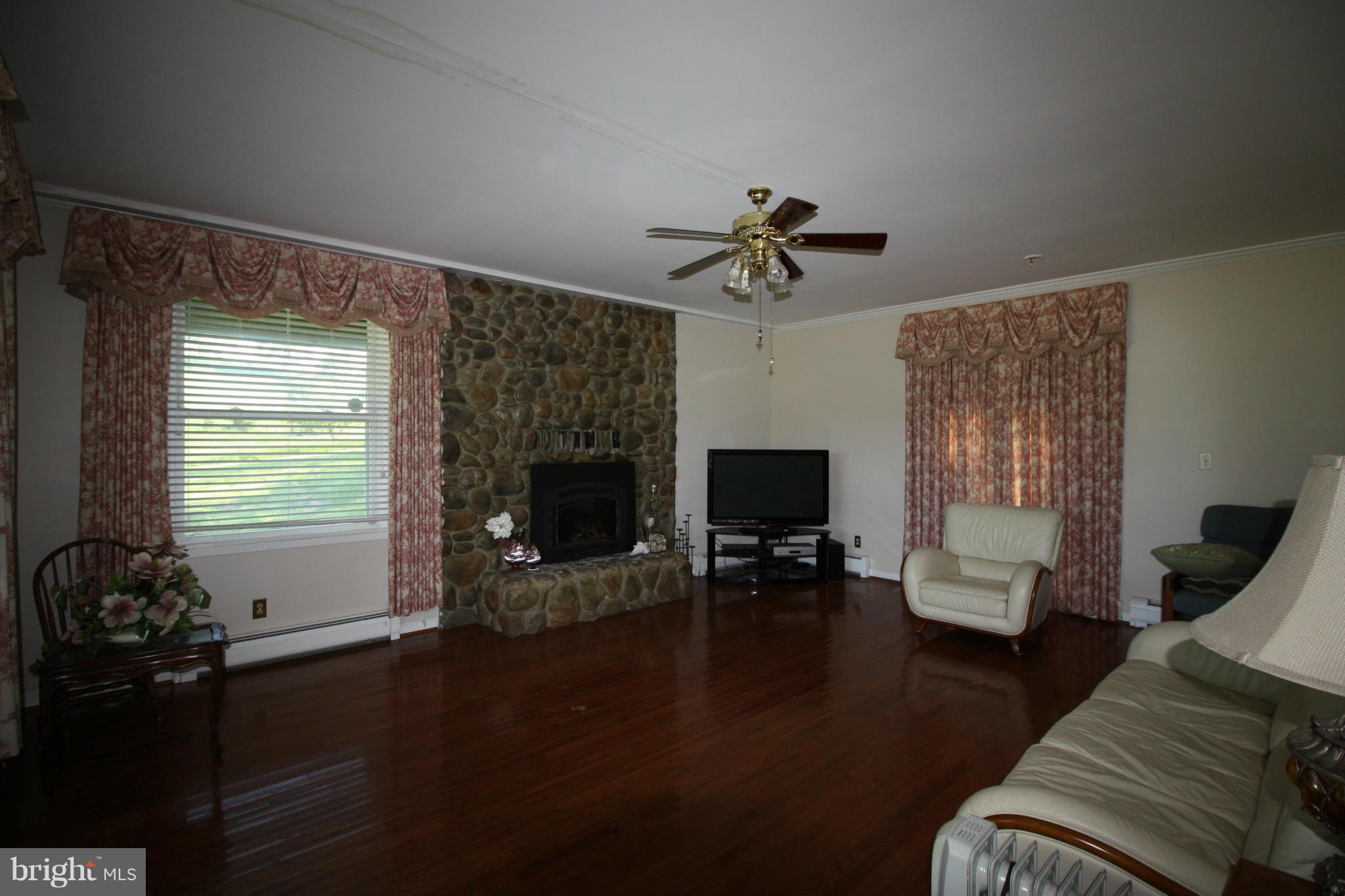 20500 Root Road Northeast Flintstone, MD 21530 - Photo 11 of 69 a living room with furniture and a fireplace