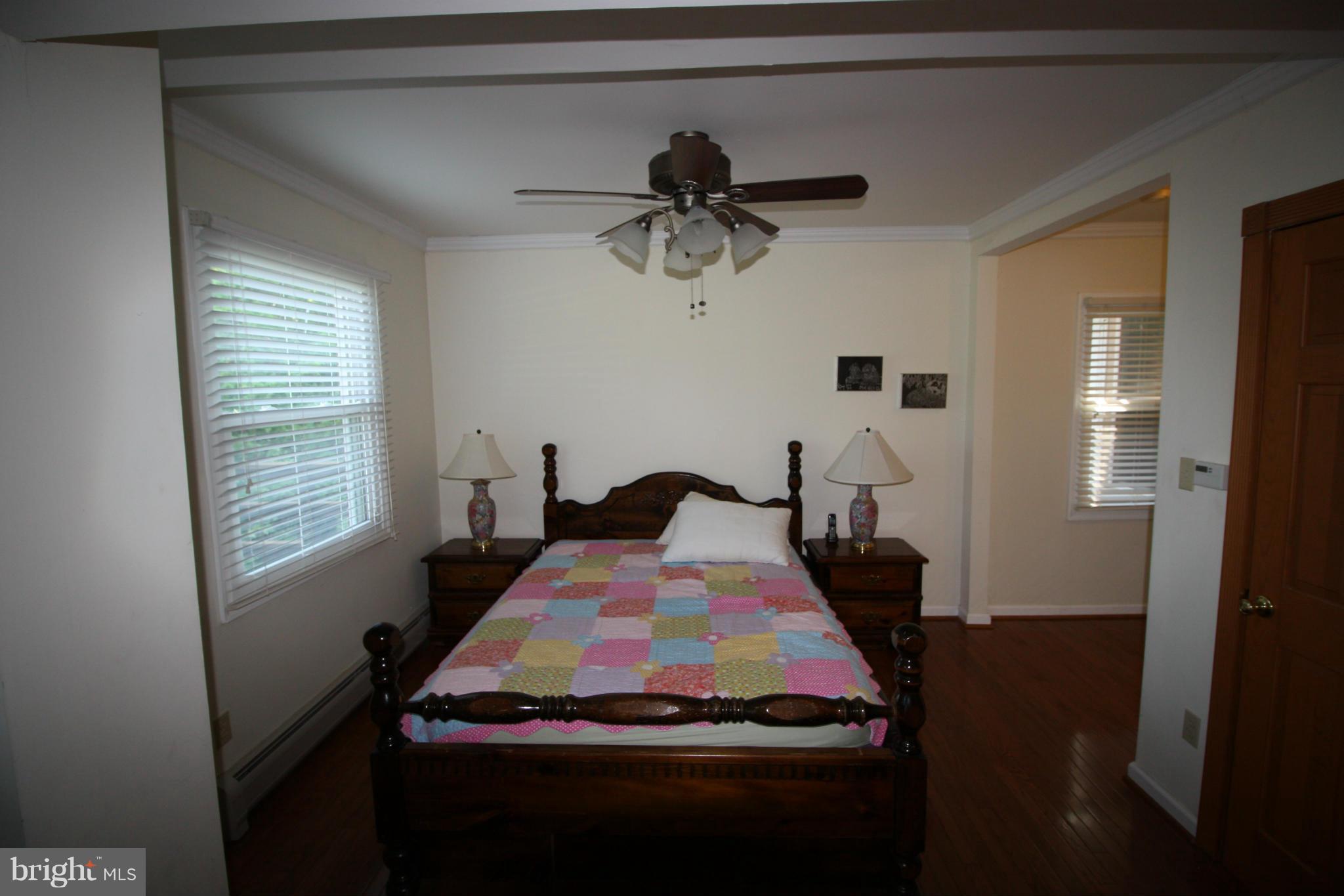 20500 Root Road Northeast Flintstone, MD 21530 - Photo 13 of 69 a bed sitting in a bedroom next to a window