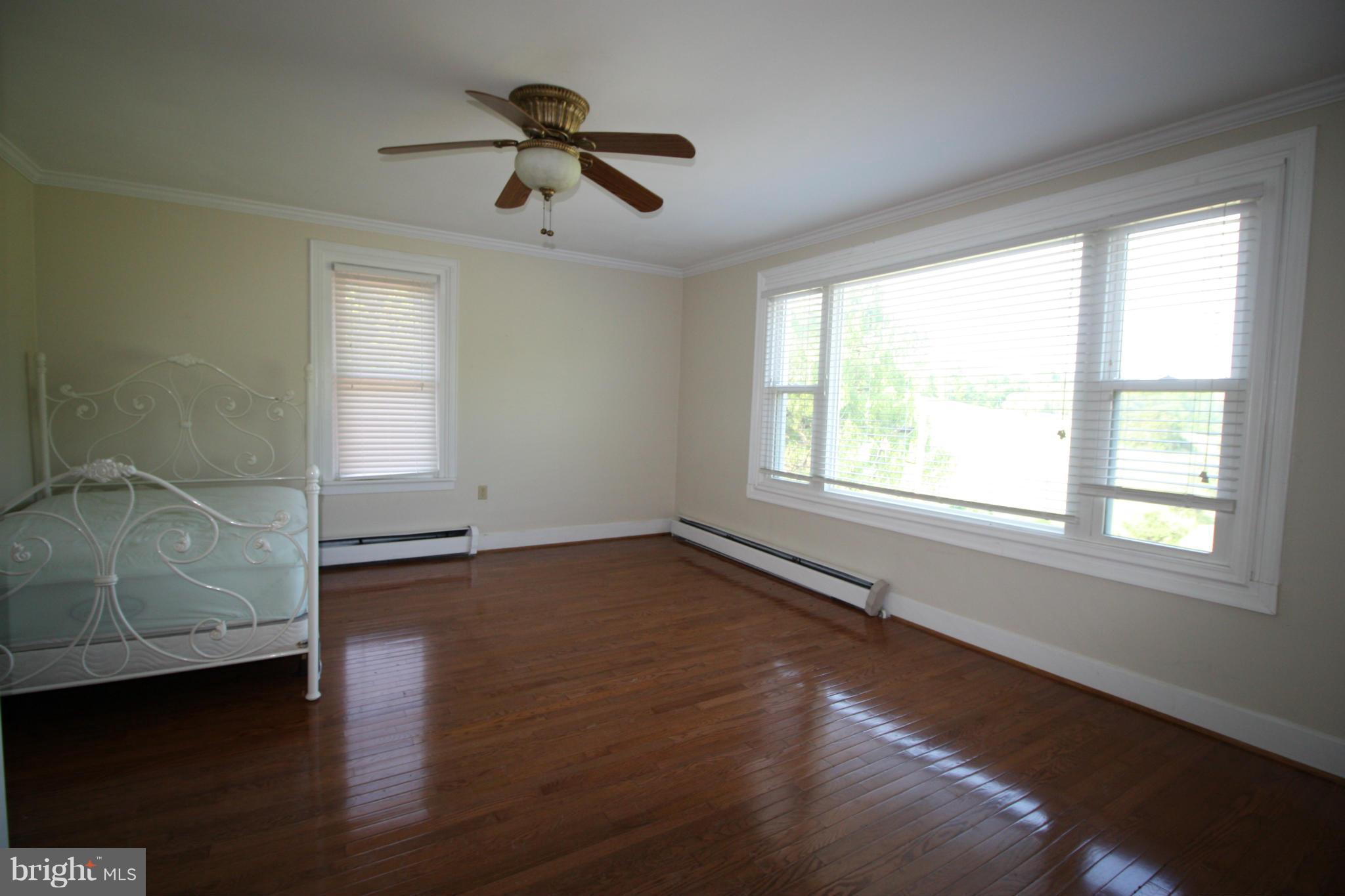 20500 Root Road Northeast Flintstone, MD 21530 - Photo 18 of 69 a view of an empty room with a window and wooden floor