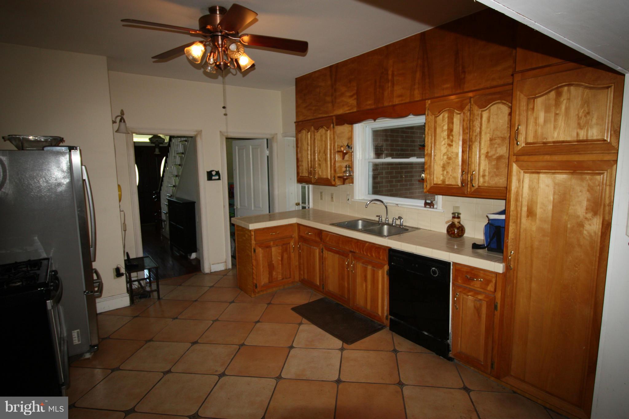 20500 Root Road Northeast Flintstone, MD 21530 - Photo 6 of 69 a kitchen with a sink cabinets and stainless steel appliances