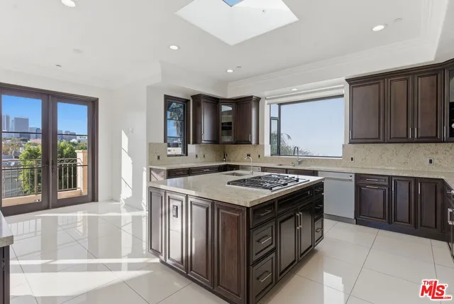 a kitchen with a stove and a sink