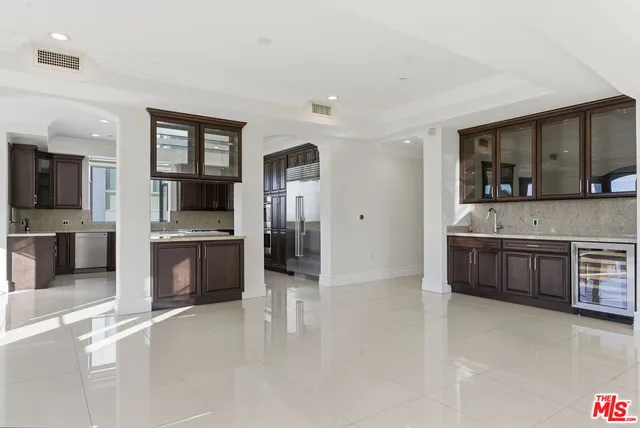 a large en suite bathroom with stainless steel appliances