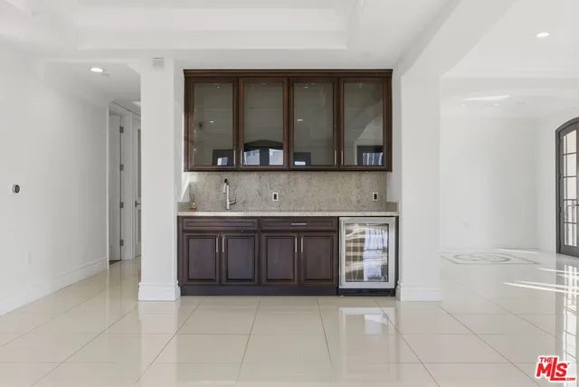 a kitchen with a stove and a sink
