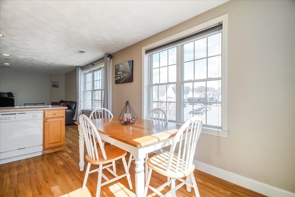 103 Elliott Street, Unit 12 Beverly, MA 01915 - Photo 13 of 25 a view of a dining room with furniture window and outside view