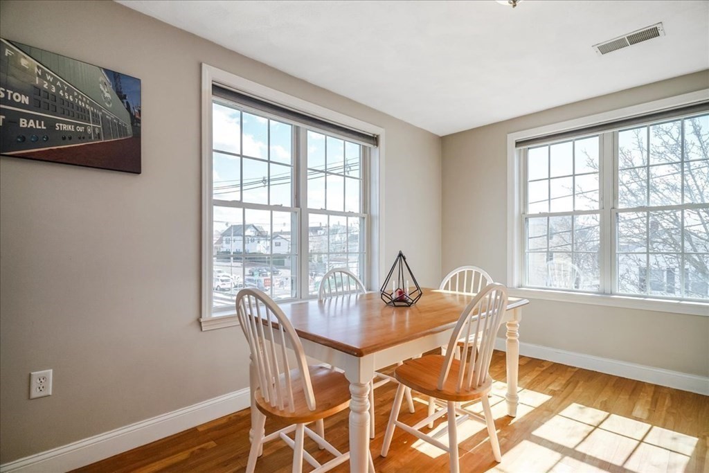 103 Elliott Street, Unit 12 Beverly, MA 01915 - Photo 14 of 25 a dining room with furniture and window