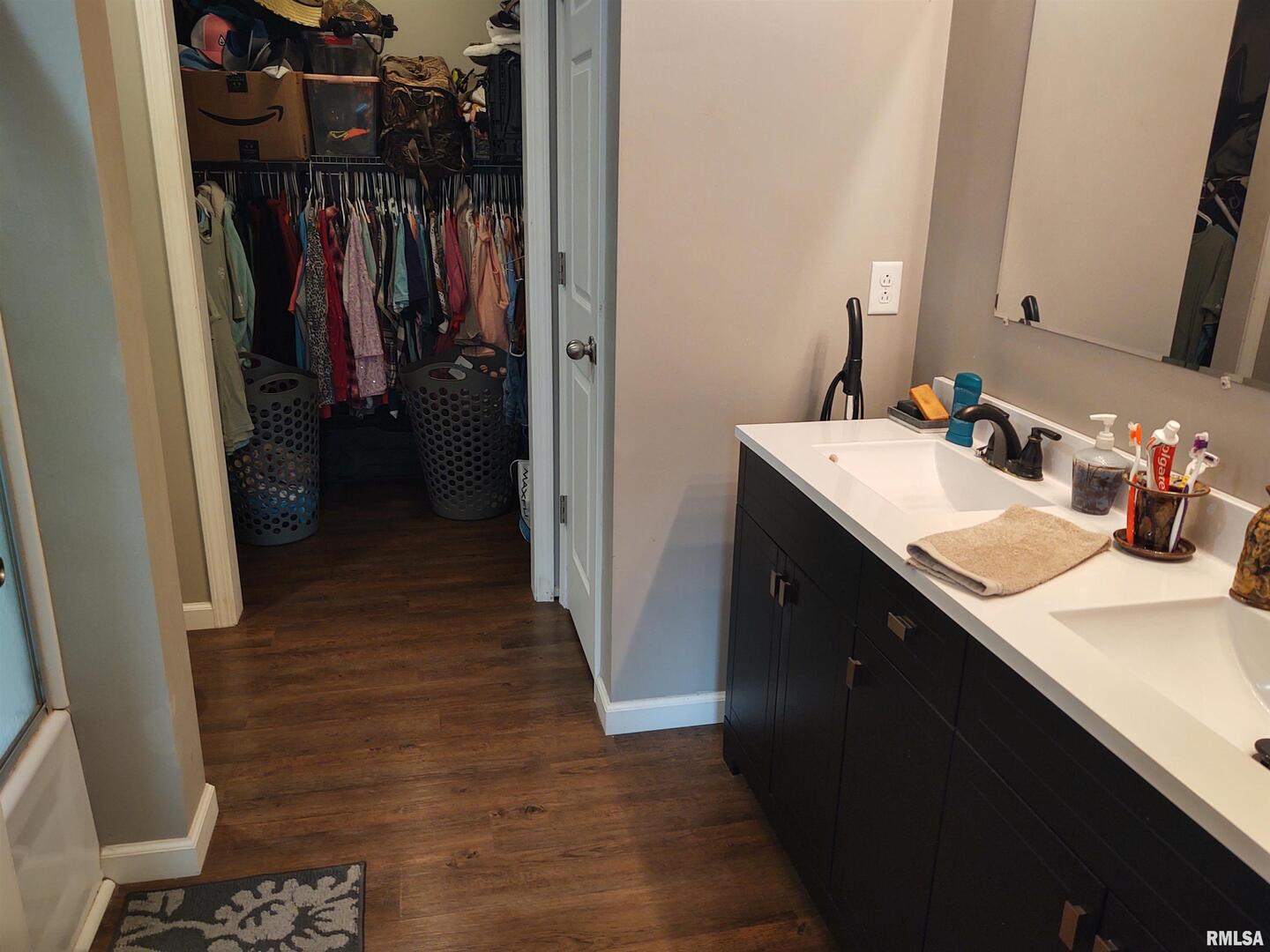 1470 Old Bloomfield Road Vienna, IL 62995 - Photo 15 of 25 a bathroom with a sink a mirror and shower