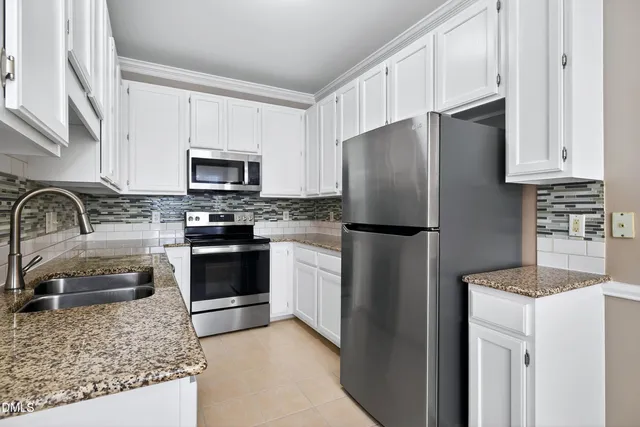 a view of a hallway with closet in a room