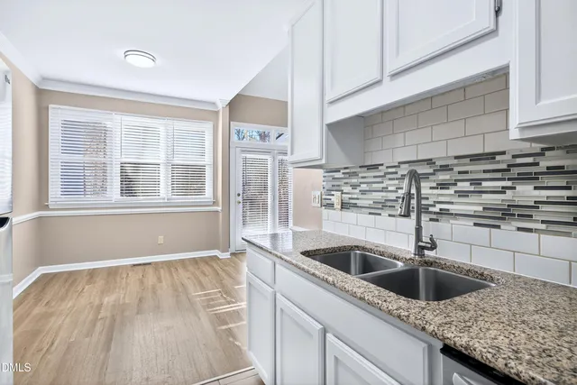 a view of washer and dryer with wooden floor
