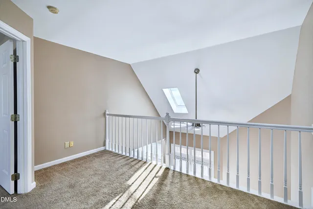 a view of house with swimming pool and sitting area