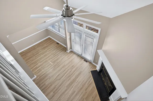 a front view of a house with garden and lake view