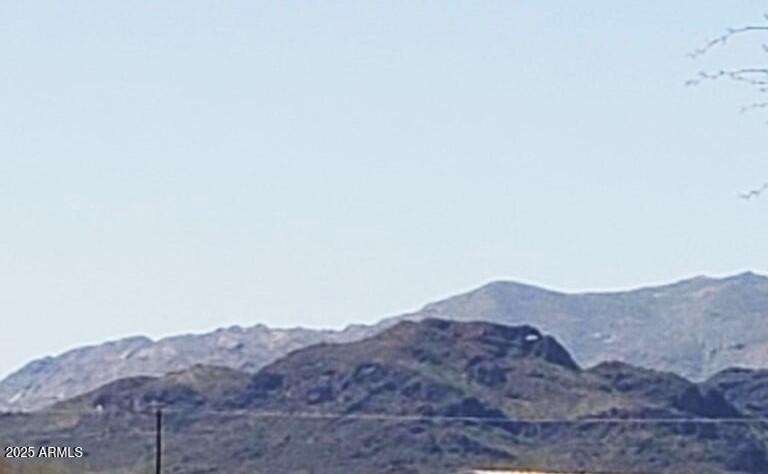 51252 West Buffalo Dog Road Aguila, AZ 85320 - Photo 6 of 6 a view of a dry field with mountains in the background