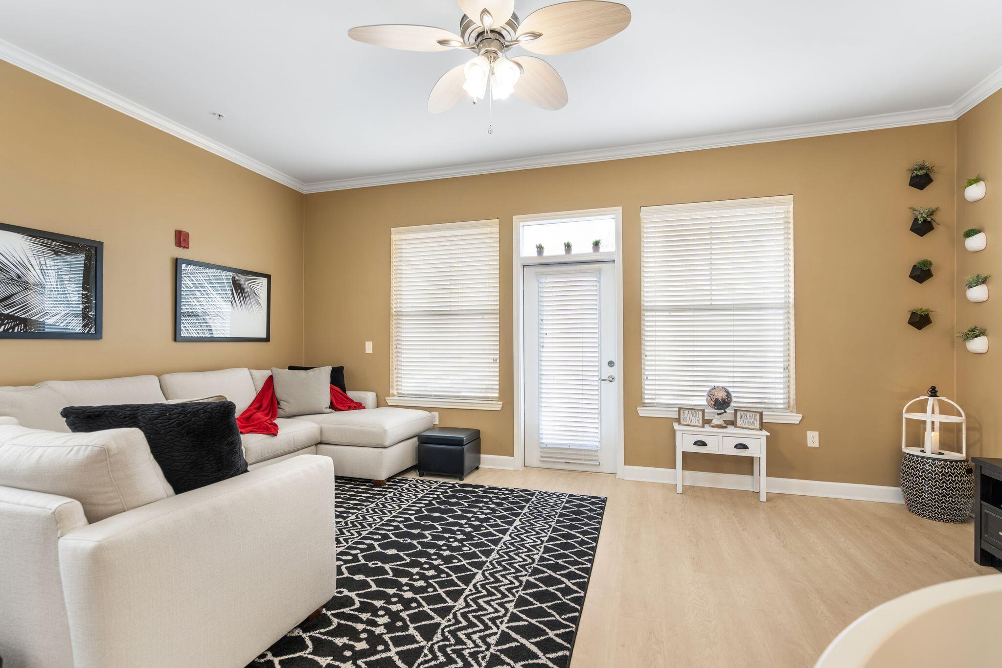8700 Front Beach Road, Unit 6310 Panama City Beach, FL 32407 - Photo 12 of 42 a living room with furniture and a window