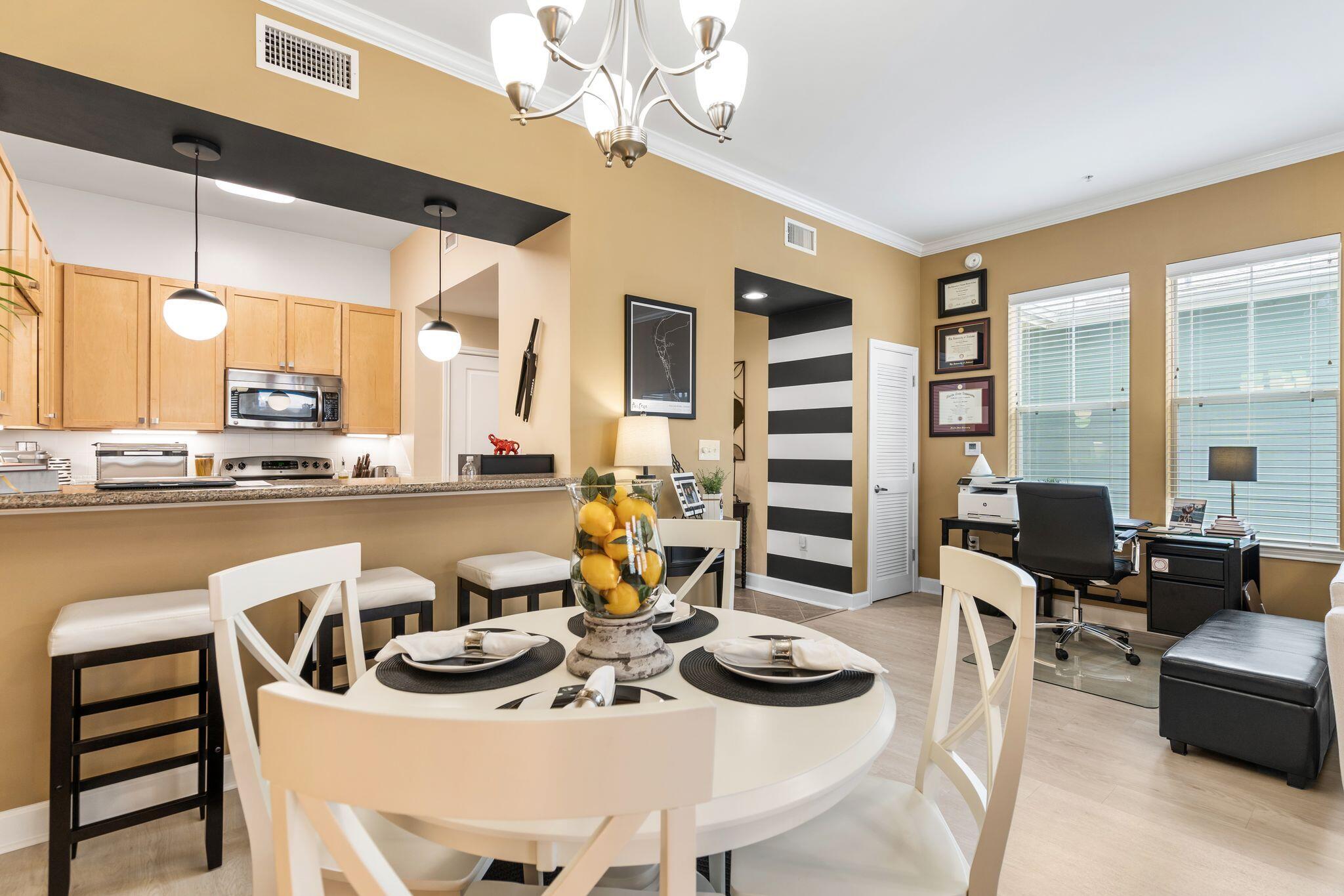 8700 Front Beach Road, Unit 6310 Panama City Beach, FL 32407 - Photo 16 of 42 a view of a dining room with furniture and chandelier