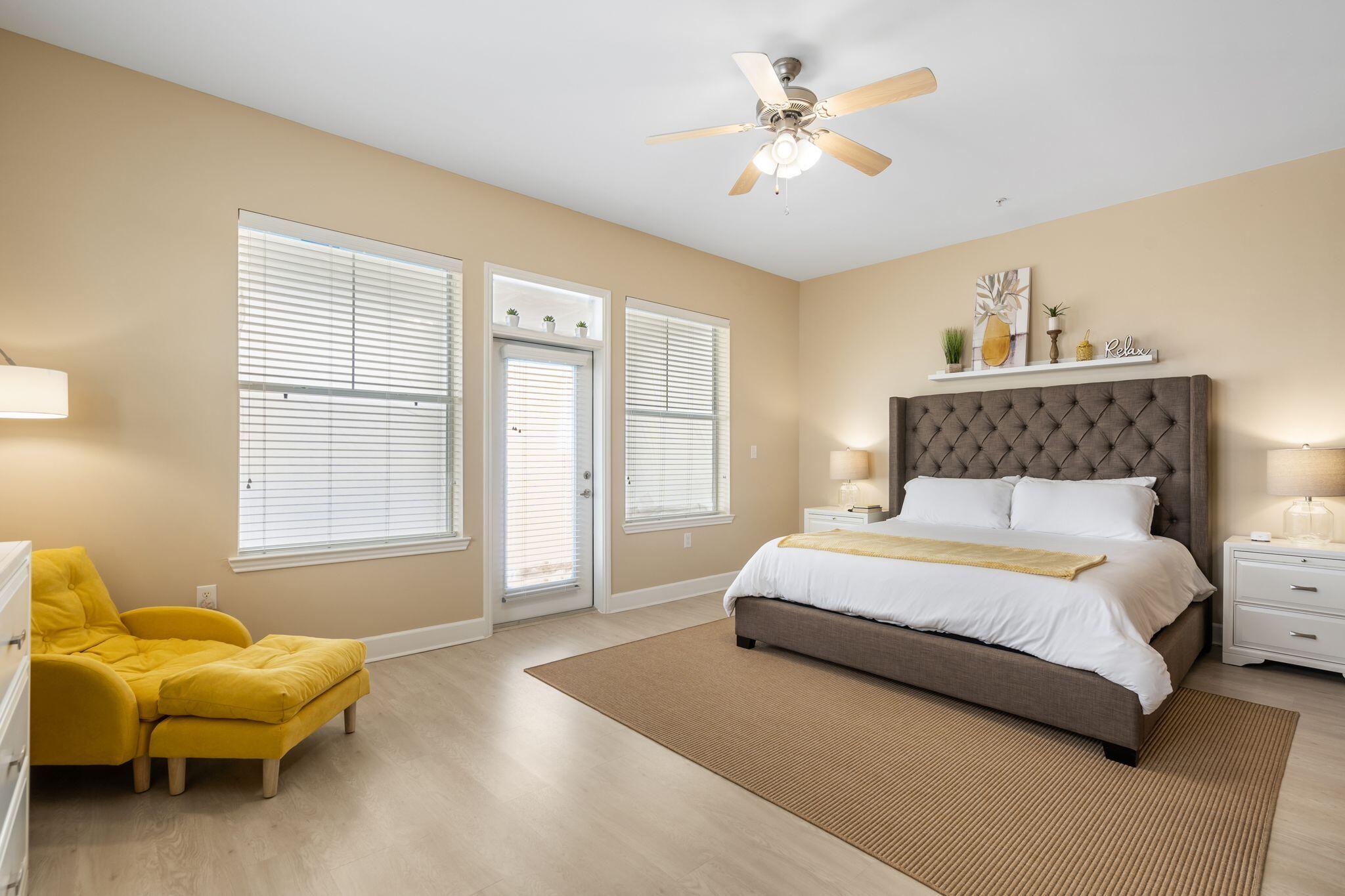 8700 Front Beach Road, Unit 6310 Panama City Beach, FL 32407 - Photo 21 of 42 a spacious bedroom with a bed and a couch