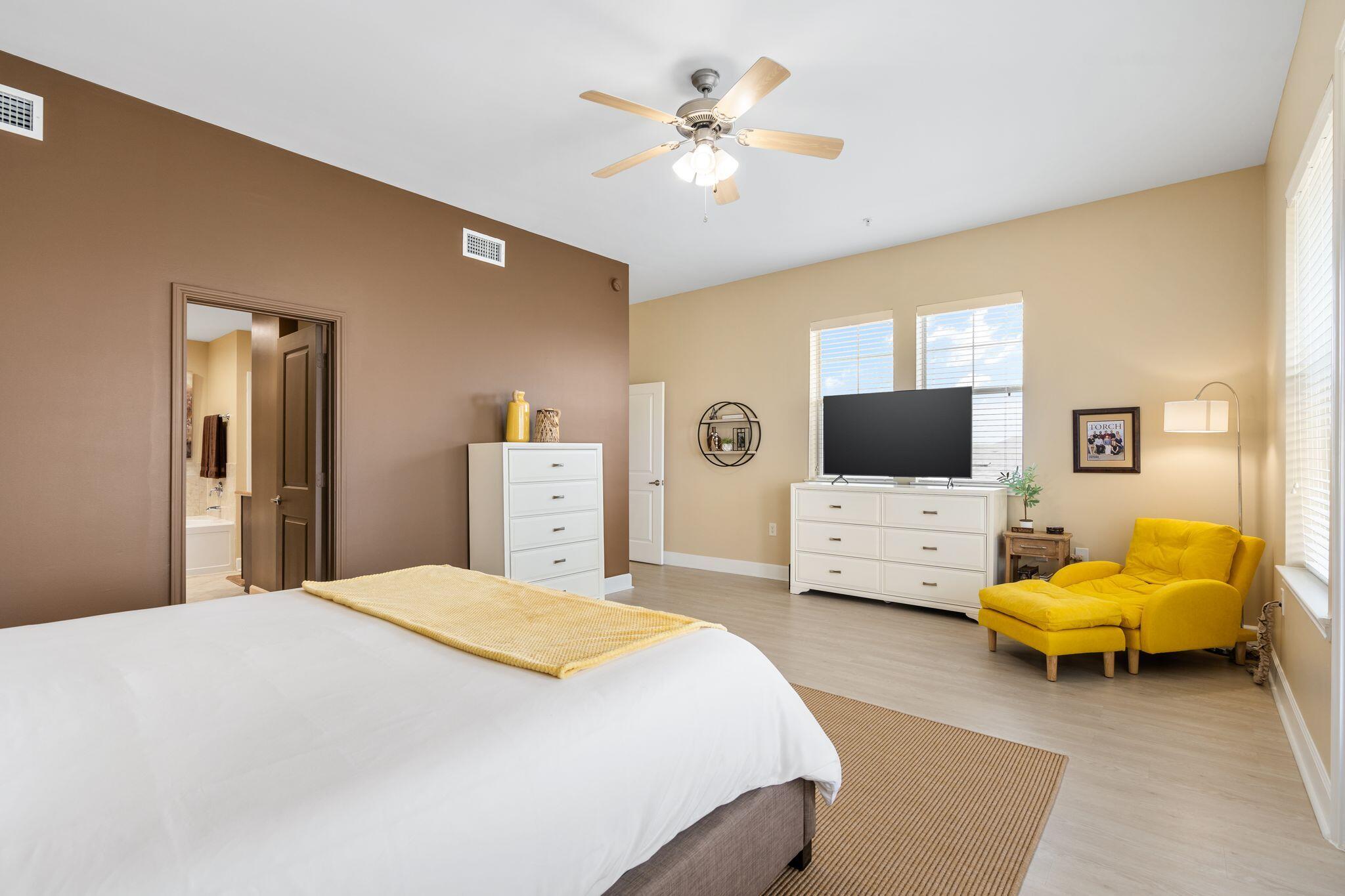 8700 Front Beach Road, Unit 6310 Panama City Beach, FL 32407 - Photo 22 of 42 a bedroom with a bed and furniture
